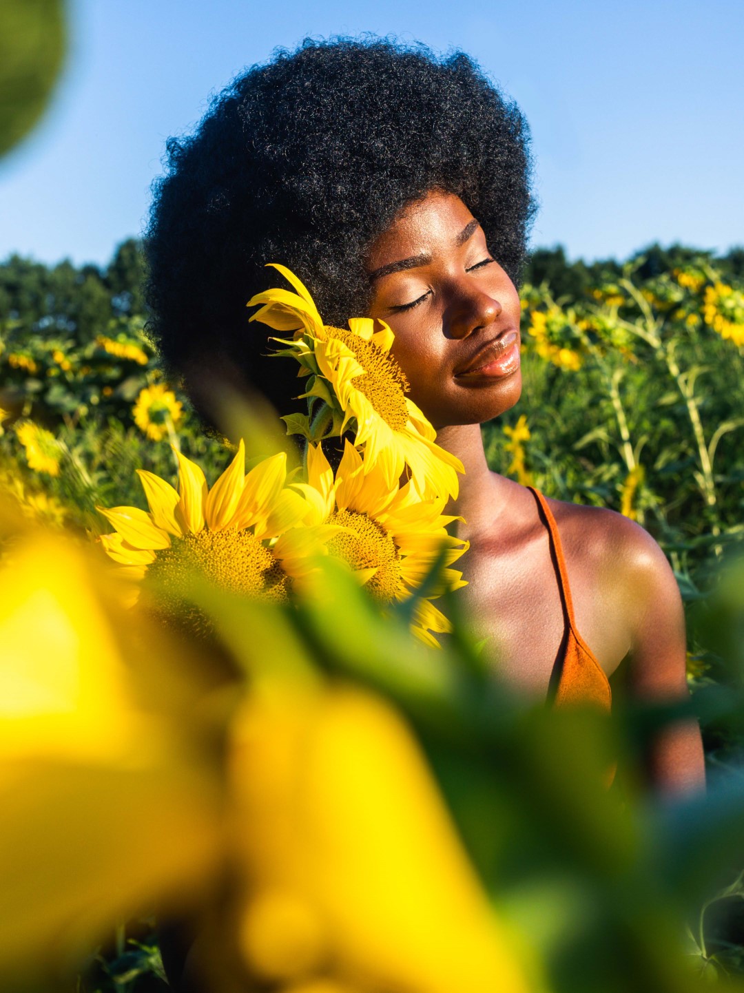 Woman in a field with sunflowers